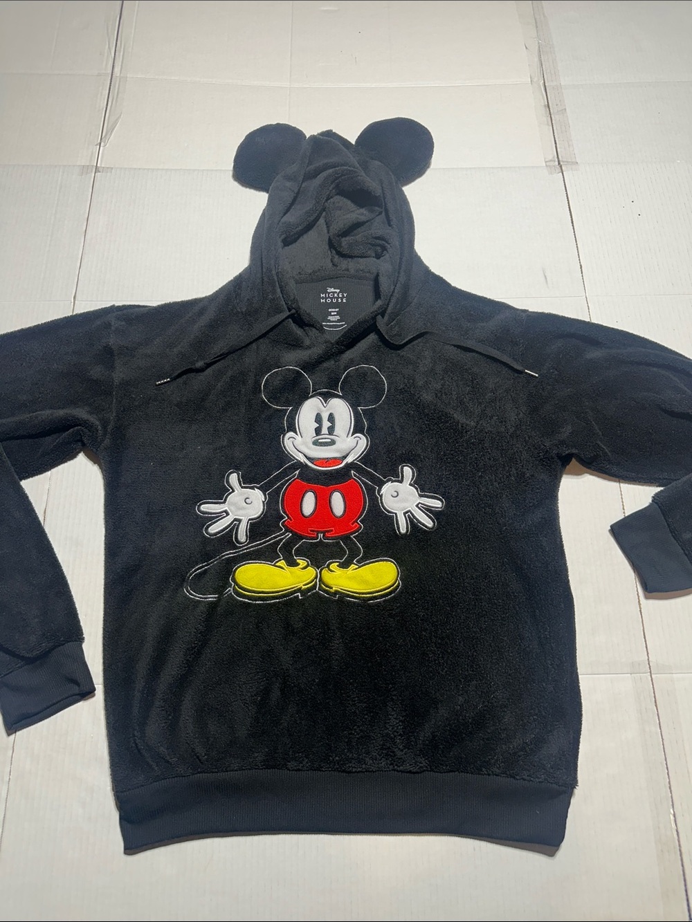 Disney Mickey Mouse light fleece in black w front design ears and pull strings
